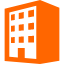 オレンジ色の4階建てマンション